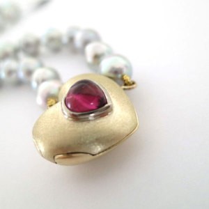 gold locket with pearls and pink tourmaline is an example of our bespoke design jewellery 